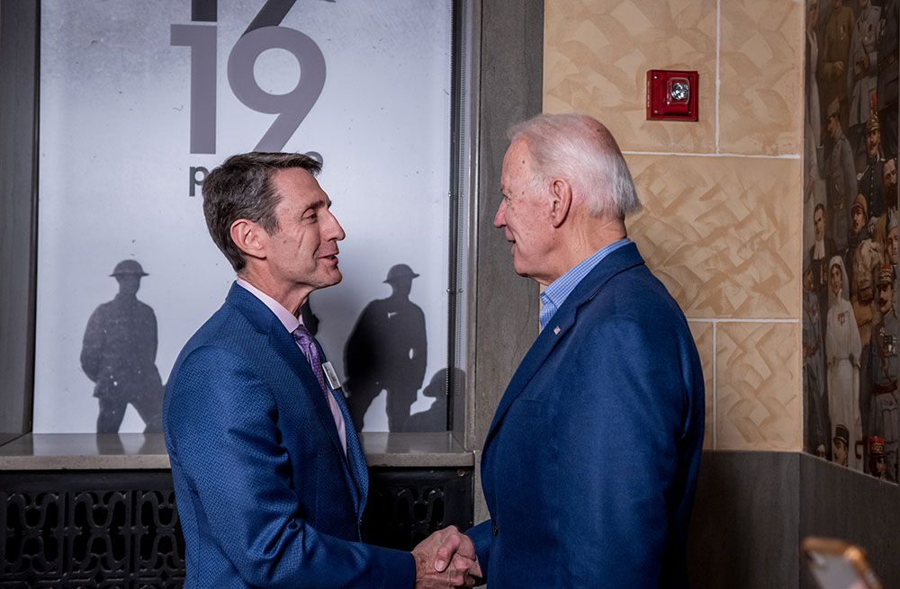 Matthew Naylor shaking hands with President Joe Biden